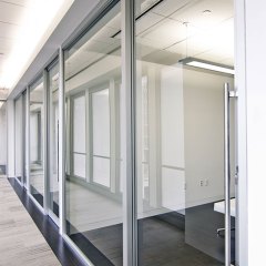 Office front gravity lock systems glass demountable walls.