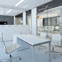 A modern white office with movable partitions.