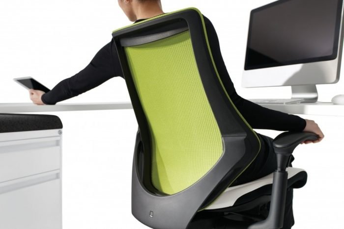 Man leaning back in green spree Ergonomic Mesh Task Chair