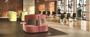 open concept office furniture in a large room with brick walls and office furniture in soft pastels
