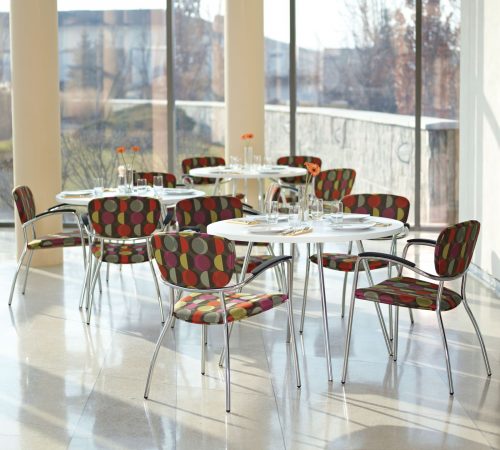 Studio photograph of patterned Caprice 3365 chairs in a cafe setup.