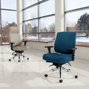 Studio photography of a high backed and medium backed Triumph rolling office chairs. One chair uses a marine blue cushion and the high backed chair uses cream colored upholstery.