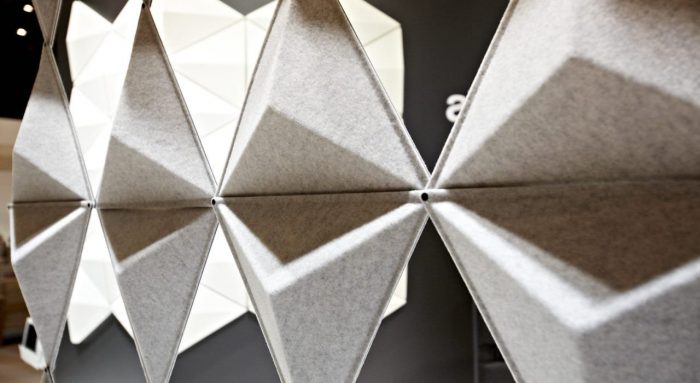 Close-up of Aircone acoustic wall panels inside an exhibition space.