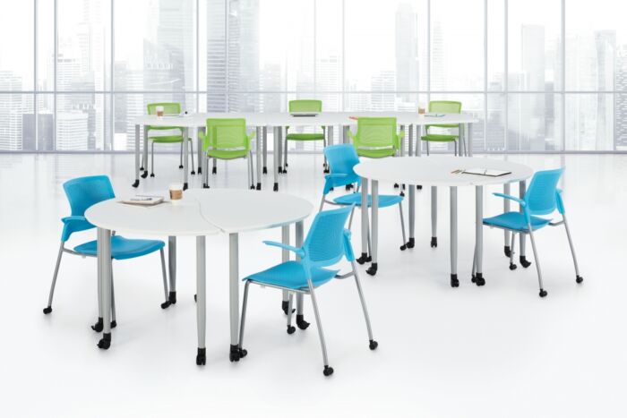 rectangular and round white training tables with florescent green and teal blue seating