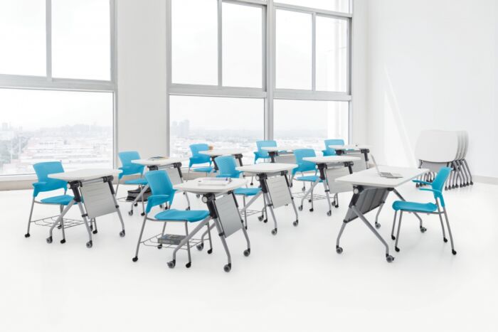 Individual training desks with teal blue seating