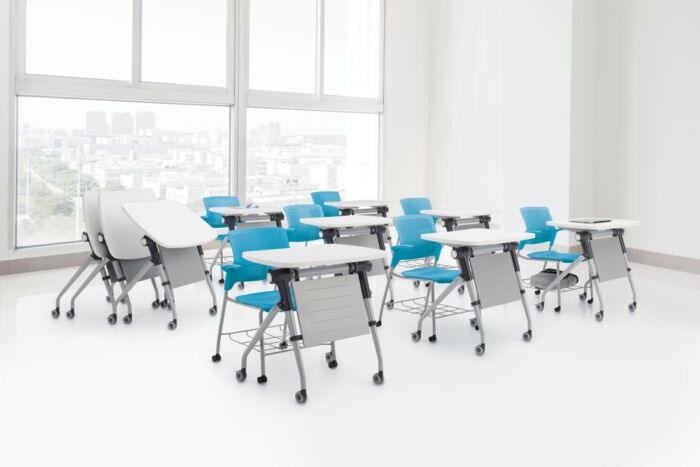 white training tables in three rows with blue teal seating